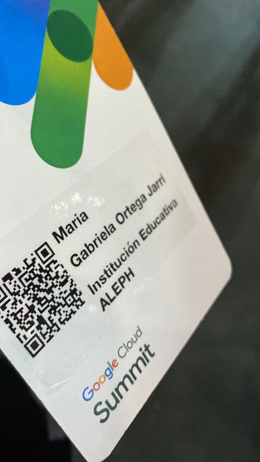 Photograph of the author’s Google Cloud Summit delegate badge.